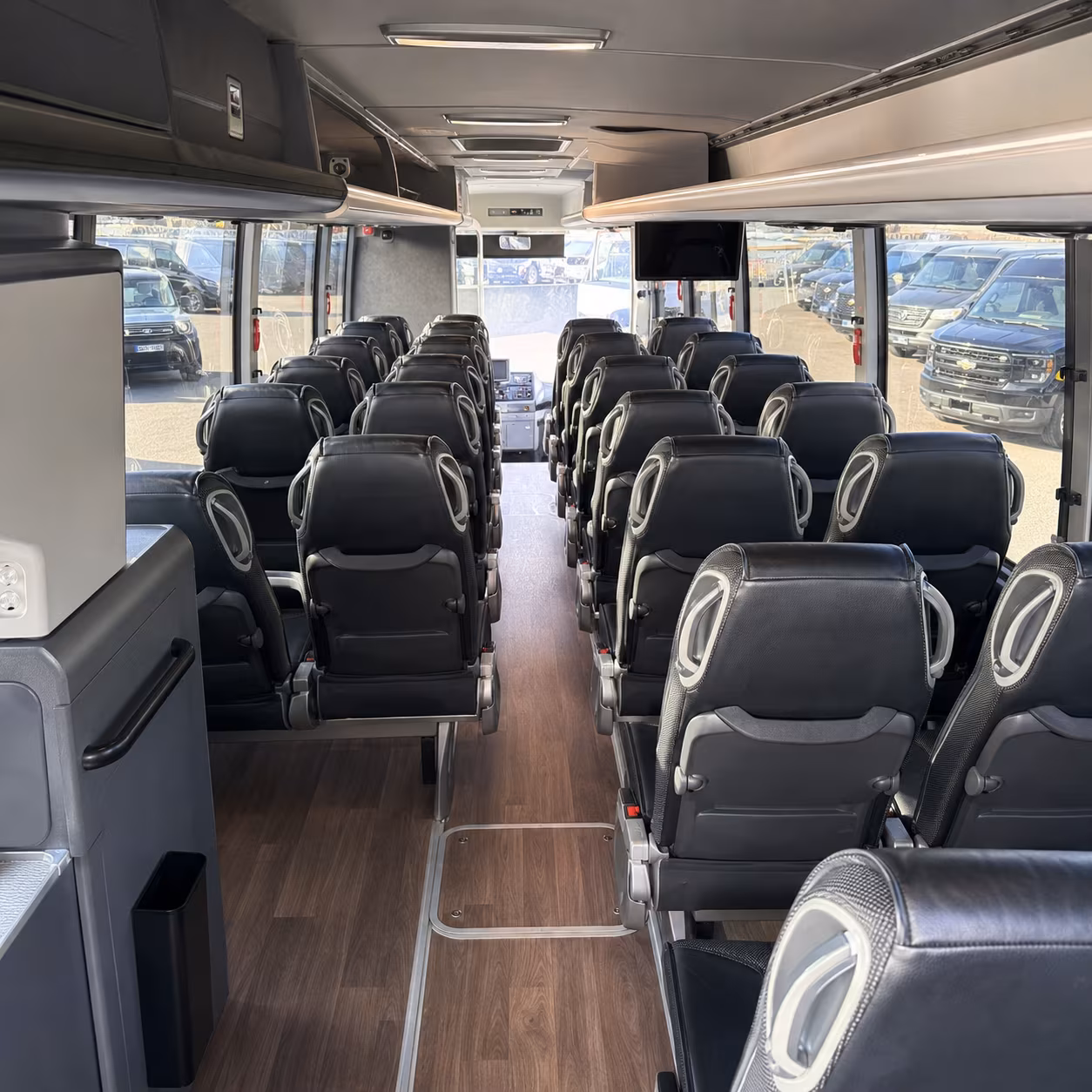 how one way transfers round trips and multi day bookings are priced for bus rentals in flint michigan